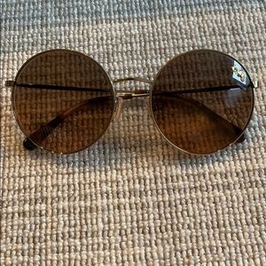 Sunglasses. Gold rimmed , brown lense